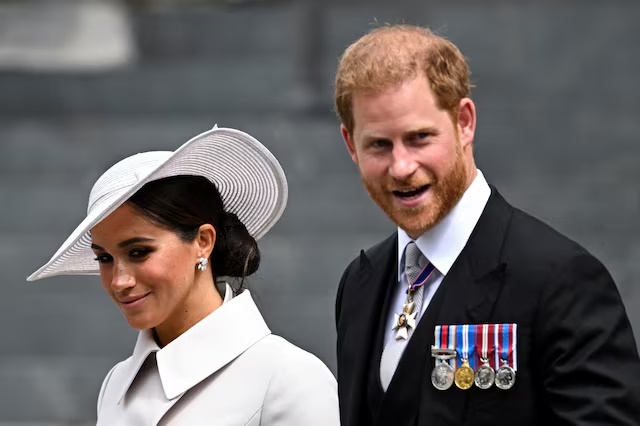 Britain's Prince Harry and his wife Meghan, Duchess of Sussex, leave after the National Service of Thanksgiving held at St Paul's Cathedral as part of celebrations marking the Platinum Jubilee of Britain's Queen Elizabeth, in London, Britain, June 3, 2022. REUTERS/Dylan Martinez/File Photo 