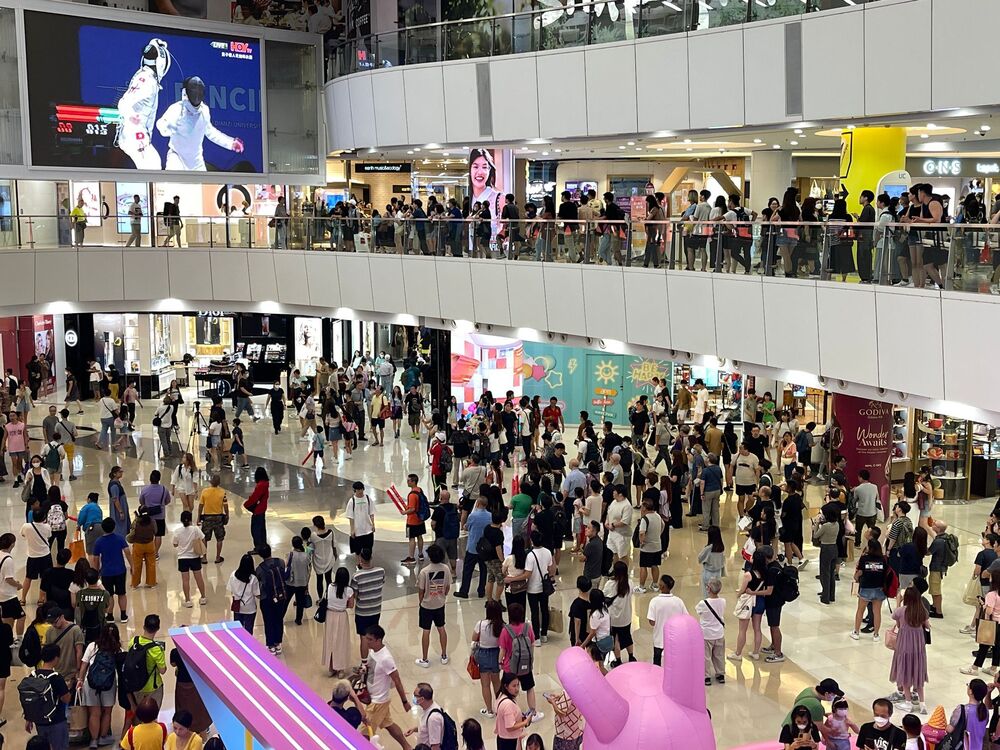 People check out a live broadcast at APM mall as John Lee cheers with athletes. SING TAO People check out a live broadcast at APM mall as John Lee cheers with athletes. SING TAO