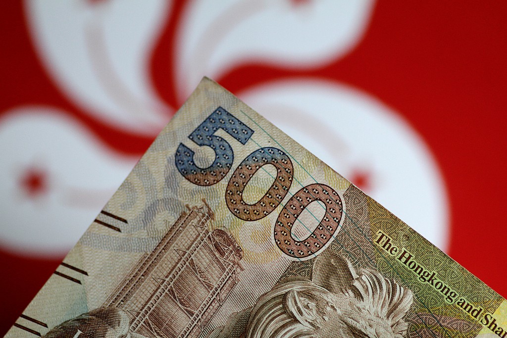 A weaker currency could help the city's real estate market and attract more tourists and talent as living costs get cheaper. (SING TAO)