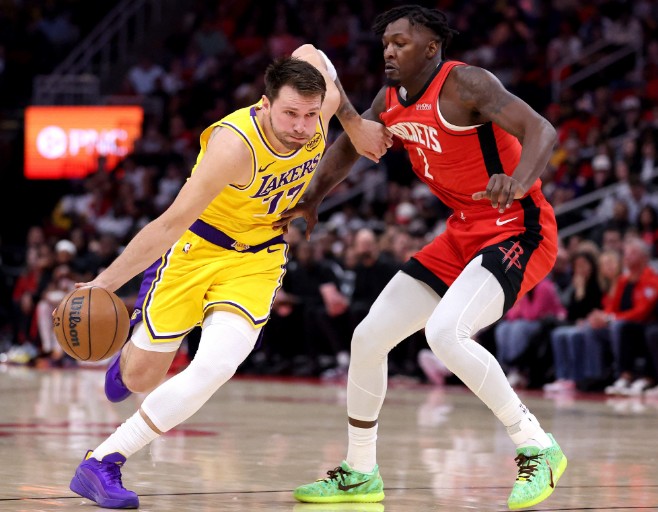 Luka Doncic drives to the basket against Dorian Finney-Smith. AFP 