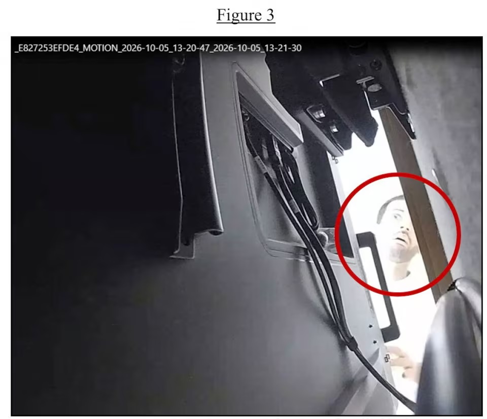 A handout photo shows what the US Justice Department says is Abdulrahman Alfozan, a Saudi national employed as an OpenAI engineer, checking a hidden audio recording device in an executive conference room at the AI company, at a location given as San Francisco, California, US, October 5, 2026. US Department of Justice/Handout via REUTERS