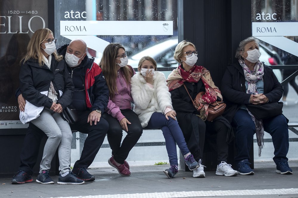 Commuters in Rome, Italy at a bus stop, on Monday, March 9. Commuters in Rome, Italy at a bus stop, on Monday, March 9.