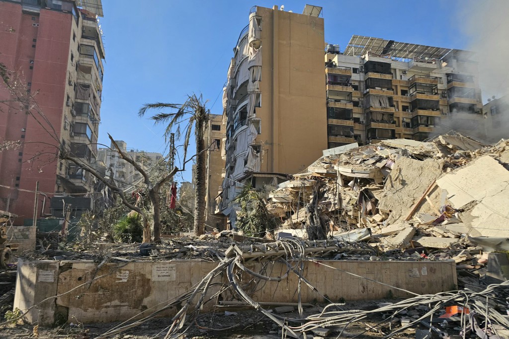 Rubble of destroyed buildings is pictured at the site of an Israeli airstrike that targeted Rweiss neighbourhood in Beirut's southern suburbs, on March 8, 2026. (AFP)