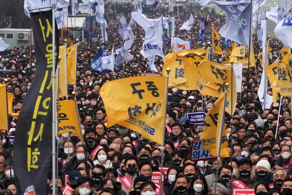 Doctors stage a rally against the government's medical policy in Seoul, South Korea, Sunday, March 3, 2024. South Korean officials said Tuesday they are seeking to get the leaders of thousands of striking junior doctors to face police investigations as part of legal repercussions for their walkouts that have disrupted hospital operations. (AP Photo/Ahn Young-joon) Doctors stage a rally against the government's medical policy in Seoul, South Korea, Sunday, March 3, 2024. South Korean officials said Tuesday they are seeking to get the leaders of thousands of striking junior doctors to face police investigations as part of legal repercussions for their walkouts that have disrupted hospital operations. (AP Photo/Ahn Young-joon)