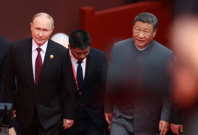 Russian President Vladimir Putin and Chinese President Xi Jinping arrive for a military parade marking the 80th anniversary of the end of World War Two, in Beijing, China September 3, 2025. Sputnik/Alexander Kazakov/Pool via REUTERS 