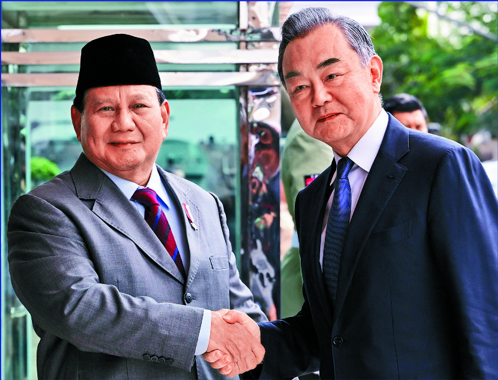 Prabowo Subianto, left, and Wang Yi. AFP Prabowo Subianto, left, and Wang Yi. AFP