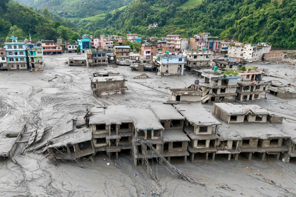 An aerial view shows houses lying deluged in sludge after flash floods at Devighat, Bidur Municipality in Nepal's Nuwakot district on August 27, 2026. (AFP) An aerial view shows houses lying deluged in sludge after flash floods at Devighat, Bidur Municipality in Nepal's Nuwakot district on August 27, 2026. (AFP)