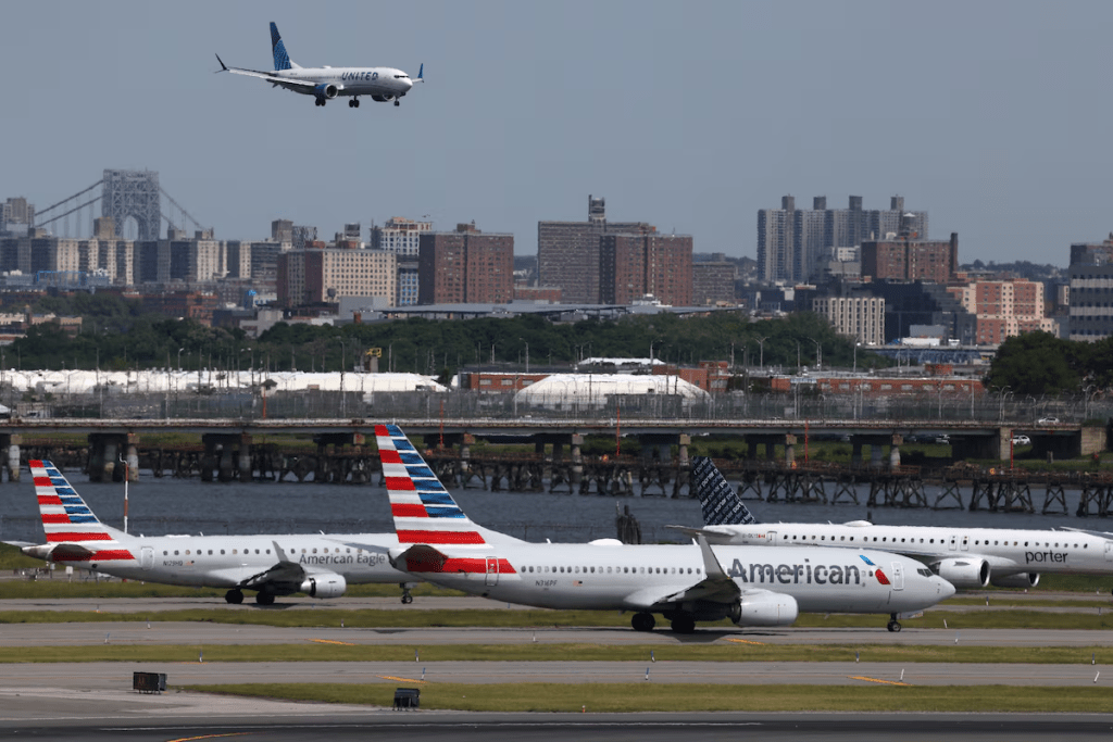 Planes cue on the runway for takeoff as another lands at New York's LaGuardia airport in New York City, U.S., May 22, 2026. REUTERS/Shannon Stapleton/File Photo