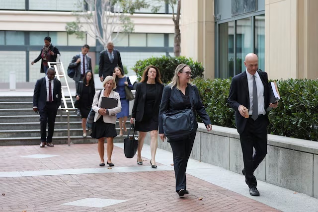 Paul Schmidt, an attorney representing Meta, walks outside a federal courthouse where a trial over allegations that Meta designed Facebook and Instagram to be addictive to children takes place, in Oakland, California, U.S., August 12, 2026. REUTERS/Manuel Orbegozo
