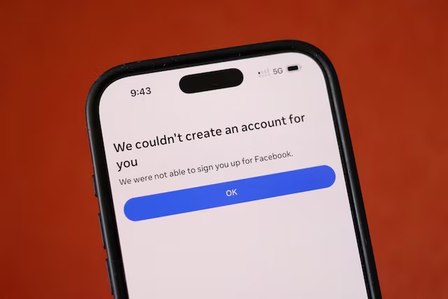 A Facebook message is displayed on a mobile phone, as Meta begins blocking new sign-ups for anyone under 16 in Australia, in this picture illustration taken December 3, 2025. REUTERS/Hollie Adams/Illustration/File Photo