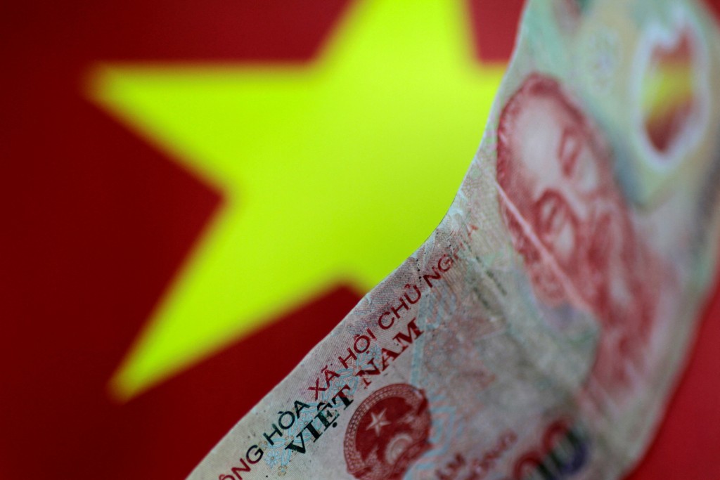 FILE PHOTO: A Vietnam Dong note is seen in this illustration photo May 31, 2017. REUTERS/Thomas White/Illustration/File Photo