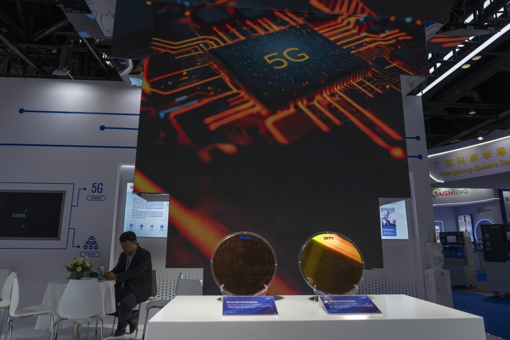 A man rests at the booth for Chinese DRAM producer ChangXin Memory Technologies during the 21st China International Semiconductor Expo in Beijing, Wednesday, Nov. 20, 2024. AP