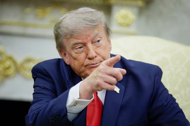U.S. President Donald Trump points his finger as he participates in a bilateral meeting with Iraqi Prime Minister Ali al-Zaidi (not pictured) in the Oval Office at the White House in Washington, D.C., U.S., July 14, 2026. REUTERS/Evan Vucci 