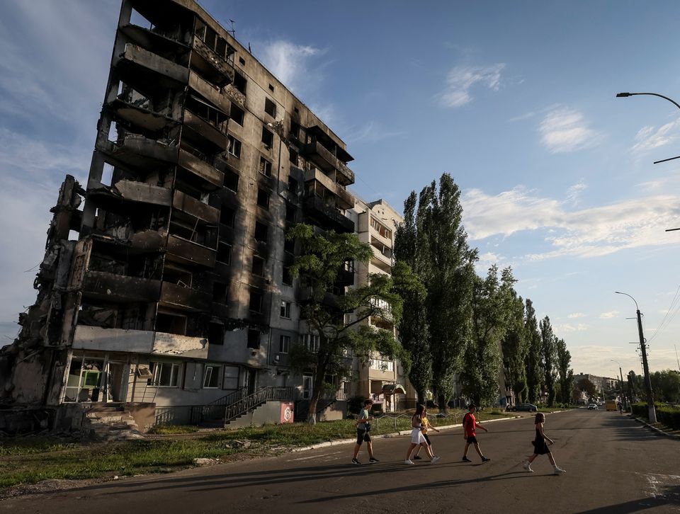 Teenagers cross a street in front of destroyed buildings amid Russia's invasion of Ukraine, in the town of Borodianka, in Kyiv region, Ukraine August 26, 2022. (Reuters) Teenagers cross a street in front of destroyed buildings amid Russia's invasion of Ukraine, in the town of Borodianka, in Kyiv region, Ukraine August 26, 2022. (Reuters)