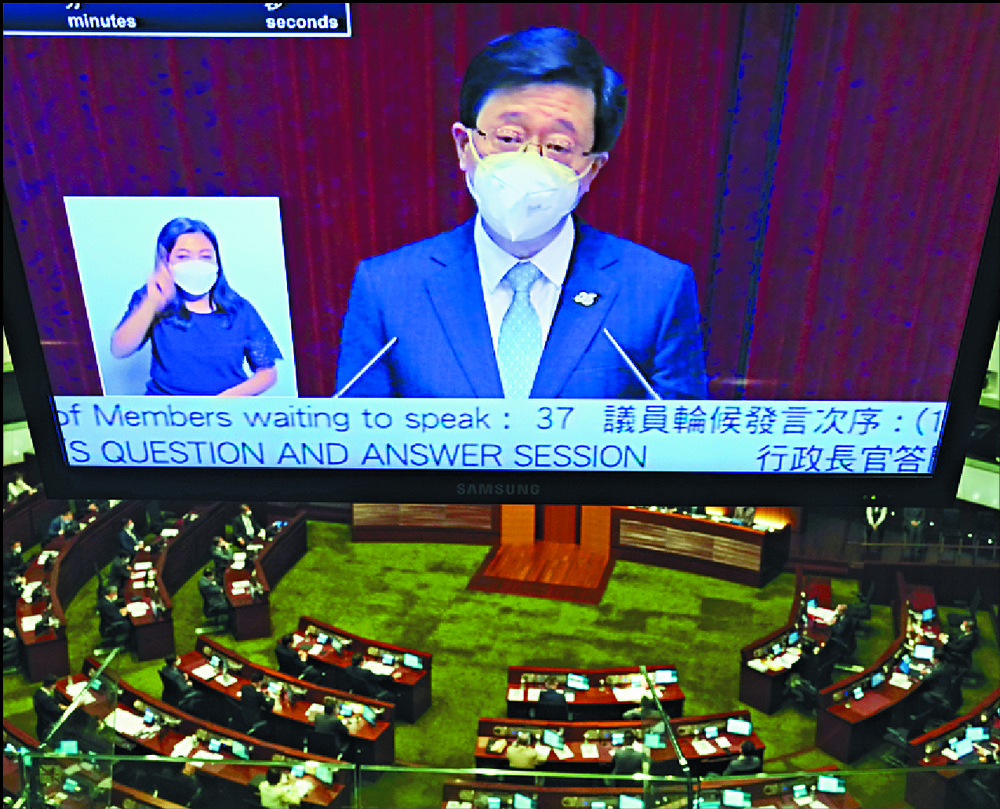John Lee speaks during a Legco Q&A session. AP John Lee speaks during a Legco Q&A session. AP