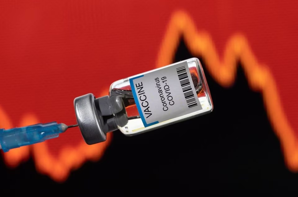 A vial labelled 'VACCINE Coronavirus Covid-19' is seen in front of a stock graph in this illustration. (Reuters) A vial labelled 'VACCINE Coronavirus Covid-19' is seen in front of a stock graph in this illustration. (Reuters)