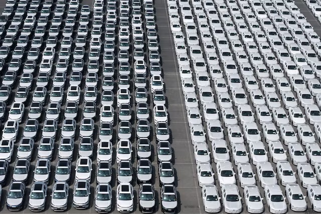 A drone view of new cars lining up at an export terminal at the port in Shanghai, China July 14, 2026. China Daily via REUTERS
