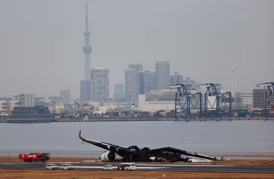 Officials investigate a burnt Japan Airlines (JAL) Airbus A350 plane after a collision with a Japan Coast Guard aircraft at Haneda International Airport in Tokyo, Japan January 3, 2024. REUTERS/Issei Kato Officials investigate a burnt Japan Airlines (JAL) Airbus A350 plane after a collision with a Japan Coast Guard aircraft at Haneda International Airport in Tokyo, Japan January 3, 2024. REUTERS/Issei Kato