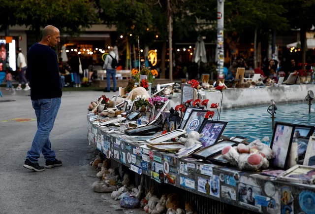 A man looks at pictures and memorabilia related to fallen soldiers, hostages and people killed during the October 7, 2023 attack by Hamas, ahead of a ceasefire between Israel and Hamas, at a public square in Tel Aviv, Israel, January 16, 2025. REUTERS/Shir Torem/File Photo A man looks at pictures and memorabilia related to fallen soldiers, hostages and people killed during the October 7, 2023 attack by Hamas, ahead of a ceasefire between Israel and Hamas, at a public square in Tel Aviv, Israel, January 16, 2025. REUTERS/Shir Torem/File Photo