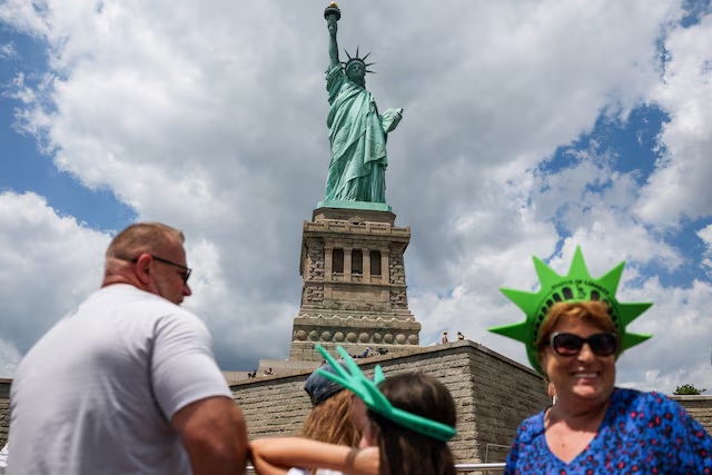 People visit the Statue of Liberty, a UNESCO World Heritage site, in New York City, U.S., July 22, 2025. REUTERS/Kylie Cooper