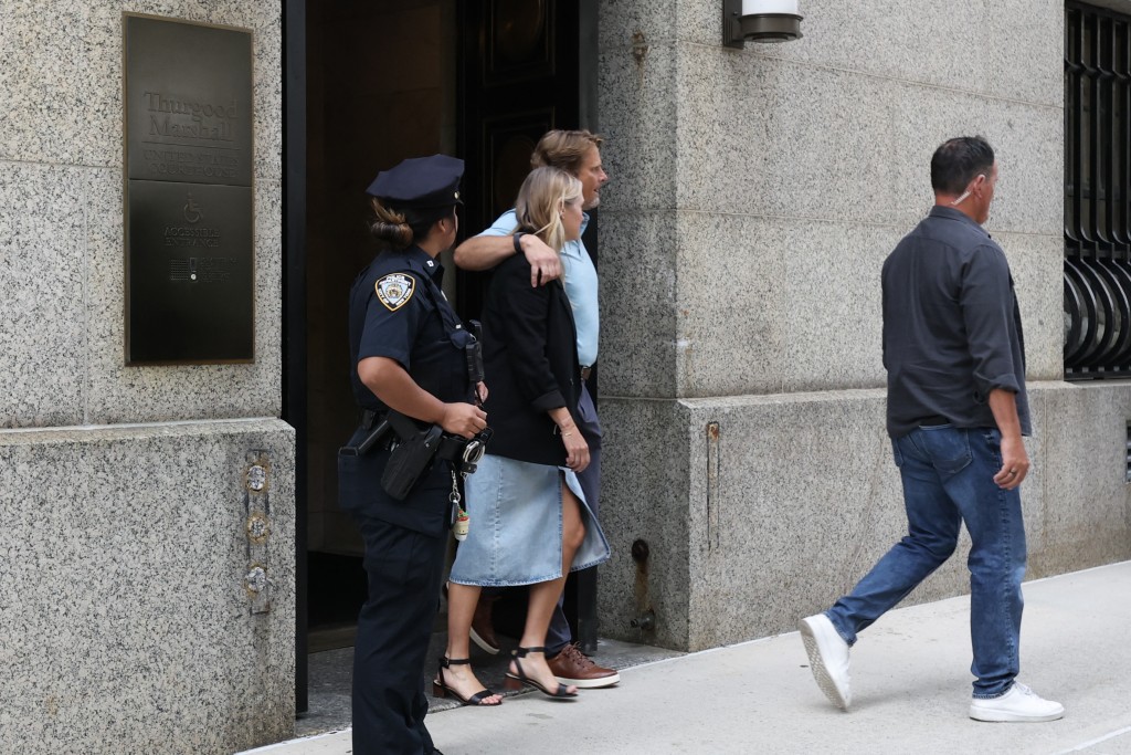 Photo by TIMOTHY A. CLARY / AFP  Family members of of Brian Thompson depart federal court after Luigi Mangione pleaded guilty to the killing of UnitedHealthcare CEO Brian Thompson, in New York, on August 14, 2026.