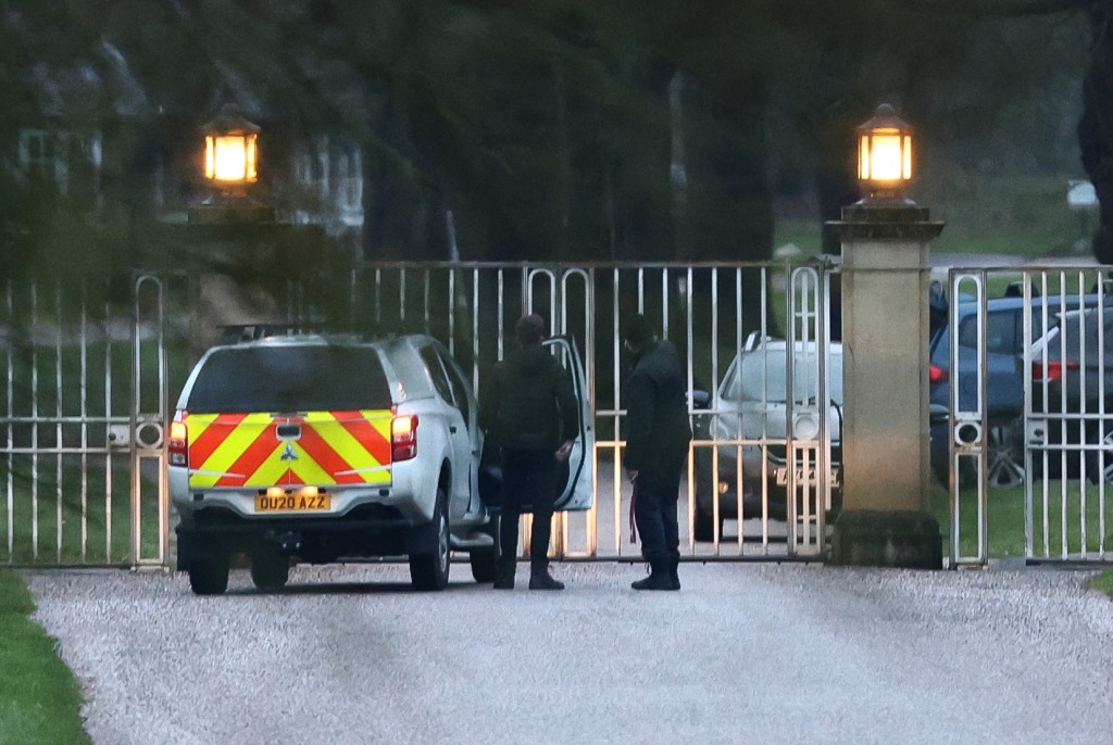 Photo by TOBY SHEPHEARD / AFP  A vehicle is seen at the entrance to the Royal Lodge, a 30-room property and former residence to Britain's former prince Andrew, at Windsor Great Park in Windsor, Berkshire on February 19, 2026, which was reportedly searched by police while Andrew was arrested earlier in the day at the king's private Sandringham estate in Norfolk.