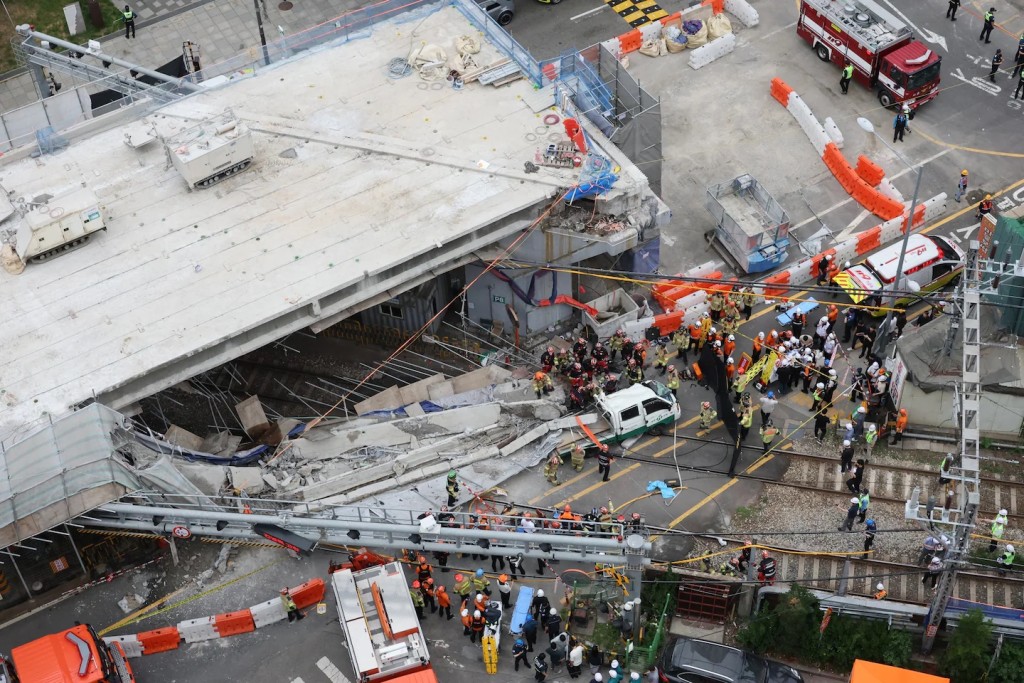 South Korean firefighters and rescue team try to search at the overpass collapsed while it was being dismantled in Seoul, South Korea, Tuesday, May 26, 2026. (Uncredited/YONHAP)