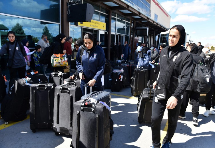 Members of Iran's women's football team exit Igdir airport, waiting to reach Dogubeyazit. AFP