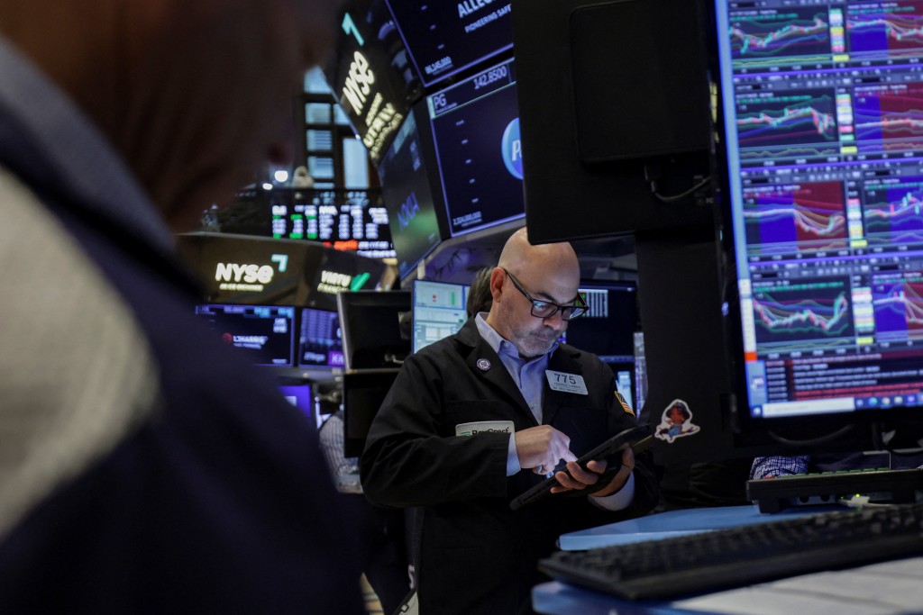 A trader works on the floor at the New York Stock Exchange (NYSE) in New York City, U.S., April 23, 2026. REUTERS/Jeenah Moon