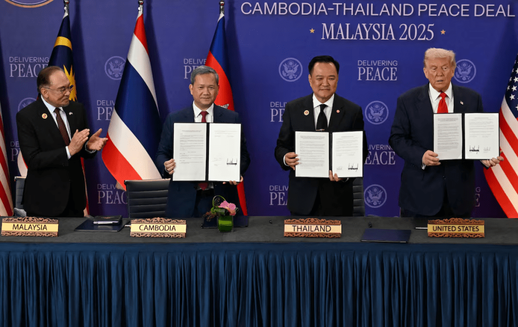 Malaysia's Prime Minister Anwar Ibrahim applauds as Cambodia's Prime Minister Hun Manet, Thailand's Prime Minister Anutin Charnvirakul and U.S. President Donald Trump hold up documents during the ceremonial signing of a ceasefire agreement between Thailand and Cambodia on the sidelines of the 47th Association of Southeast Asian Nations (ASEAN) Summit in Kuala Lumpur, Malaysia, October 26, 2025. Mohd Rasfan/Pool via REUTERS/ File Photo