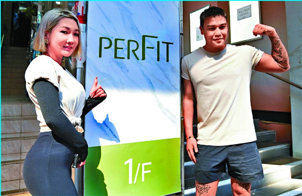Several former instructors of Physical Fitness have started work at perFIT, with customers resuming their workouts at its Wan Chai branch. Another gym will reopen in Mong Kok. SING TAO Several former instructors of Physical Fitness have started work at perFIT, with customers resuming their workouts at its Wan Chai branch. Another gym will reopen in Mong Kok. SING TAO