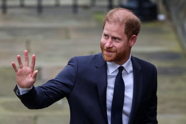 Britain's Prince Harry waves as he arrives to attend the start of the nine-week trial lawsuit against Associated Newspapers, publisher of the Daily Mail, which Britain's Prince Harry and others are suing over allegations of privacy breaches dating back 30 years, at the High Court in London, Britain. REUTERS/Isabel Infantes