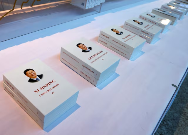 Copies of "Xi Jinping: The Governance of China" translated into nine languages are displayed outside the media center ahead of the Third Belt and Road Forum in Beijing, China October 16, 2023. REUTERS/Edgar Su/File Photo