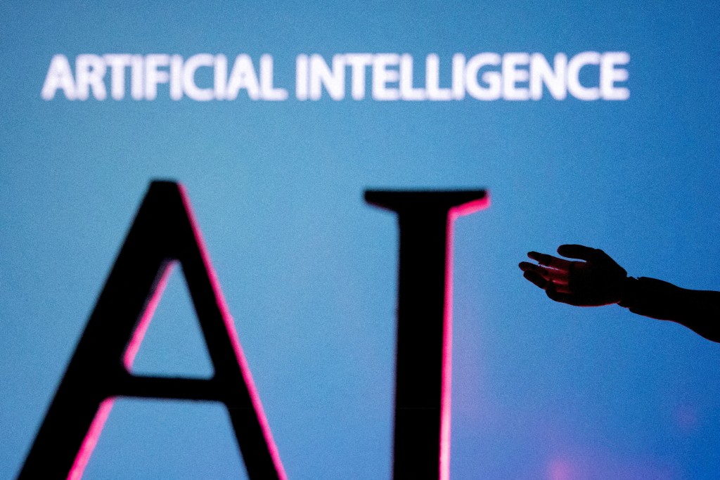 AI (Artificial Intelligence) letters and robot hand miniature in this illustration created on June 23, 2023. REUTERS/Dado Ruvic/Illustration//File Photo