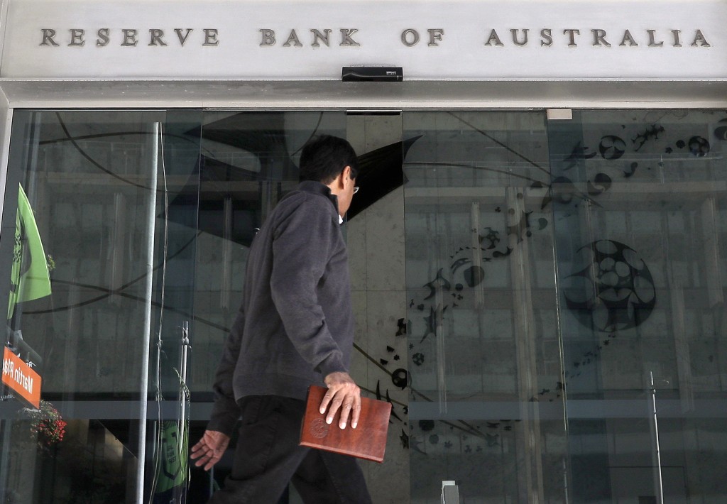 In this Oct. 1, 2019, a man walks past the Reserve Bank of Australia in Sydney. AP