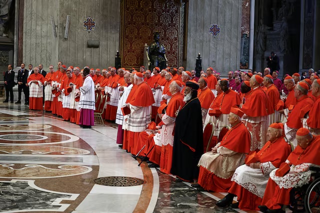 Cardinals stand, on the day of the translation of Pope Francis' body, in St. Peter's Basilica at the Vatican, April 23, 2025. REUTERS/Yara Nardi