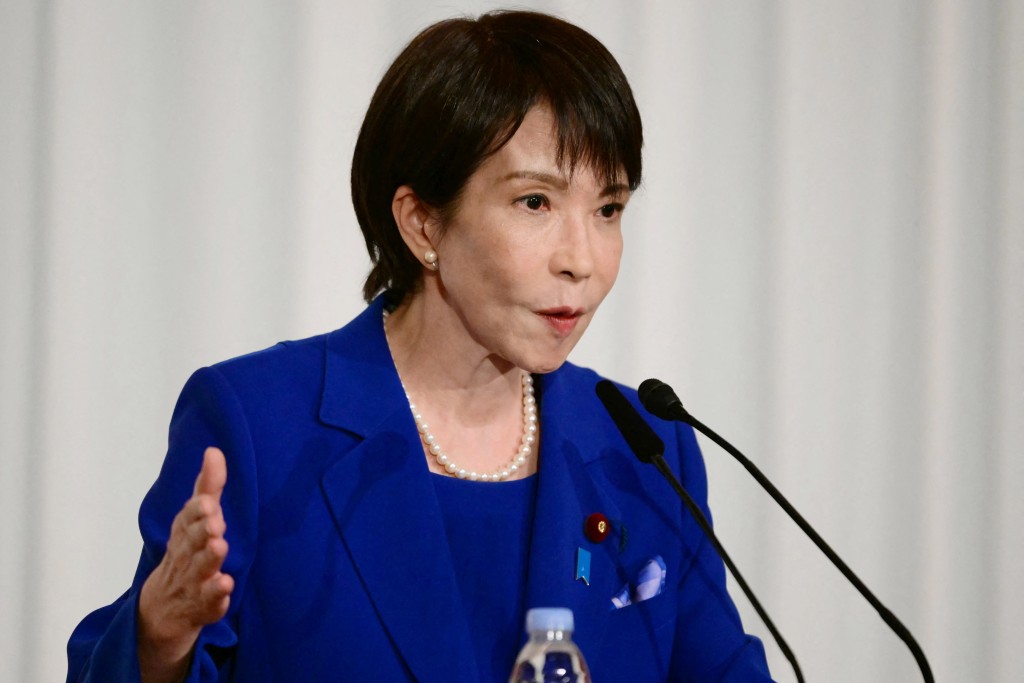 Sanae Takaichi, the newly-elected leader of Japan's ruling party, the Liberal Democratic Party (LDP), attends a press conference after the LDP presidential election in Tokyo on October 4, 2025. Conservative Sanae Takaichi hailed a "new era" on October 4 after winning the leadership of Japan's ruling party, putting her on course to become the country's first woman prime minister. (Photo by Yuichi YAMAZAKI / POOL / AFP)
