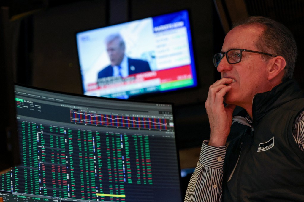 A trader works on the floor at the New York Stock Exchange (NYSE) in New York City, U.S., March 23, 2026. REUTERS/Brendan McDermid