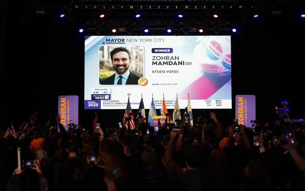 Photo by ANGELA WEISS / AFP  A screen shows New York City mayoral candidate Zohran Mamdani declared the winner during his election night event at the Brooklyn Paramount theater in Brooklyn, New York, on November 4, 2025.