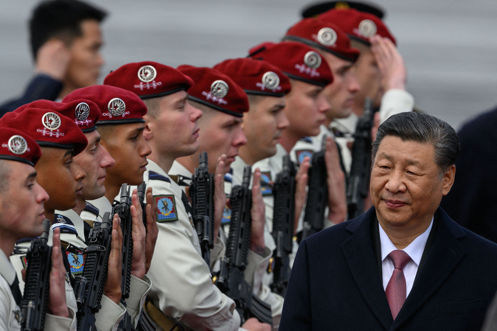 Xi Jinping walks past an honor guard upon his arrival at Tarbes' airport as part of his two-day visit to France. AFP Xi Jinping walks past an honor guard upon his arrival at Tarbes' airport as part of his two-day visit to France. AFP