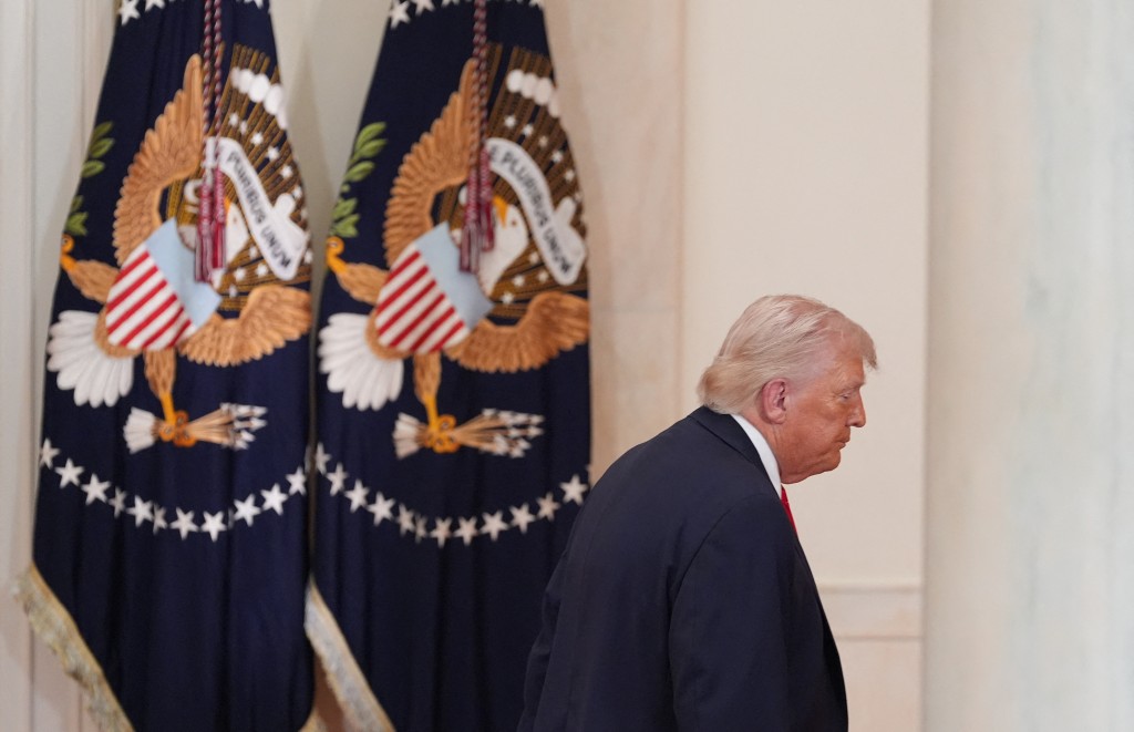 Photo by ALEX BRANDON / POOL / AFP  US President Donald Trump leaves after speaking at a televised address on the conflict in the Middle East from the Cross Hall of the White House in Washington, DC on April 1, 2026.