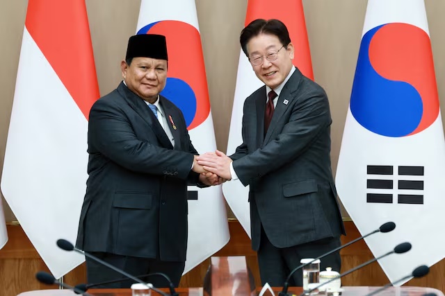South Korean President Lee Jae Myung shakes hands with Indonesian President Prabowo Subianto during their meeting at the Presidential Blue House in Seoul, South Korea, April 1, 2026. Yonhap via REUTERS