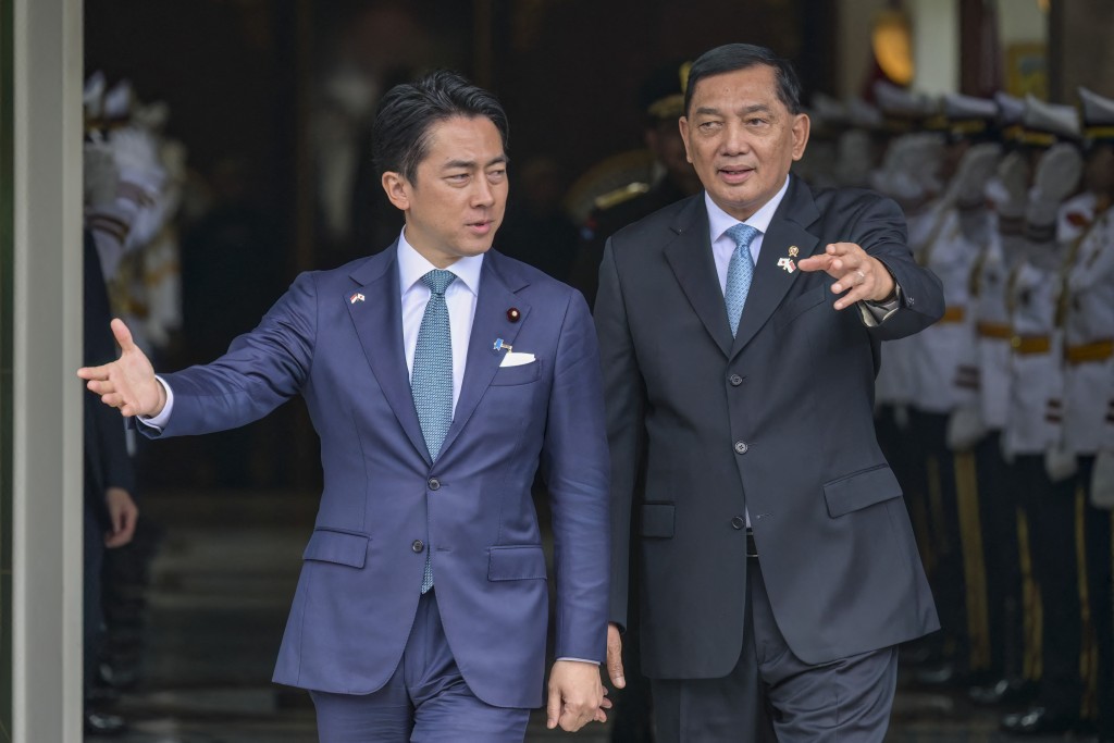 Indonesia’s Defence Minister Sjafrie Sjamsoeddin (R) walks with Japan’s Defense Minister Shinjiro Koizumi (C) at the Defence Ministry office in Jakarta on May 4, 2026. (AFP)