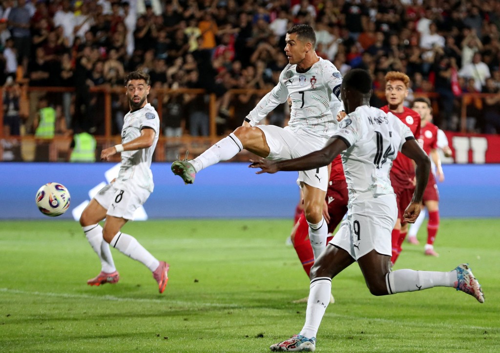 Portugal's Cristiano Ronaldo scores their second goal. (Reuters)