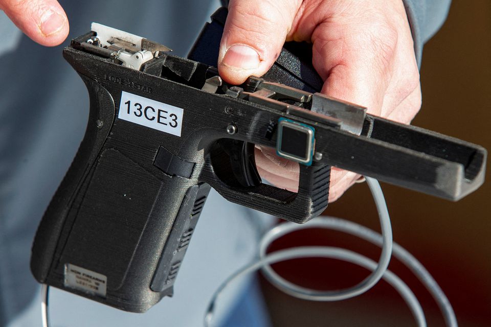 Rob Regent of SGW Designworks breaks down the inner working of the 9mm smart gun, which works only for the designated user. (Reuters) Rob Regent of SGW Designworks breaks down the inner working of the 9mm smart gun, which works only for the designated user. (Reuters)