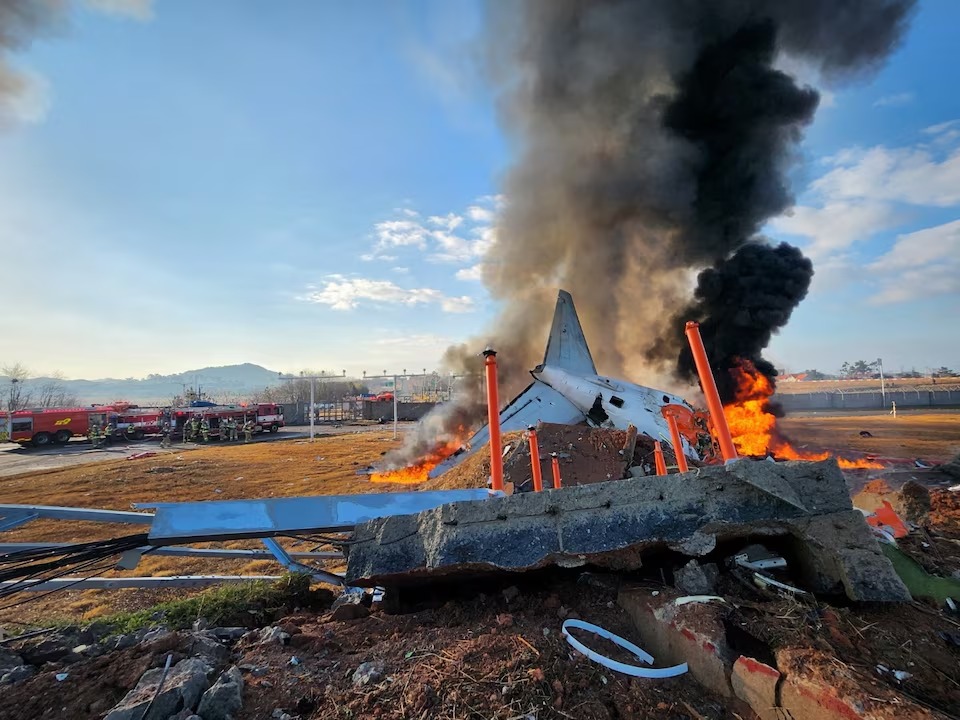 Firefighters carry out extinguishing operations on an aircraft which drove off runaway at Muan International Airport in Muan, South Jeolla Province, South Korea, December 29, 2024. (Yonhap via Reuters) Firefighters carry out extinguishing operations on an aircraft which drove off runaway at Muan International Airport in Muan, South Jeolla Province, South Korea, December 29, 2024. (Yonhap via Reuters)