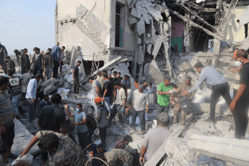 People and rescue forces work following an Israel strike on a school in Minab, Iran, February 28, 2026. Abbas Zakeri/Mehr News/WANA (West Asia News Agency) via REUTERS