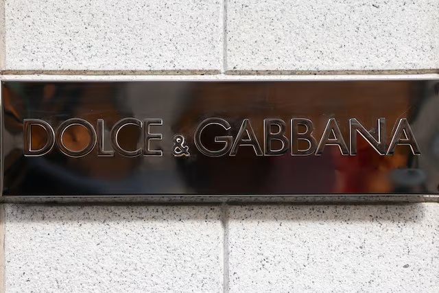 A logo of Dolce&Gabbana fashion house outside a store in Milan, Italy, September 24, 2025. REUTERS/Yara Nardi