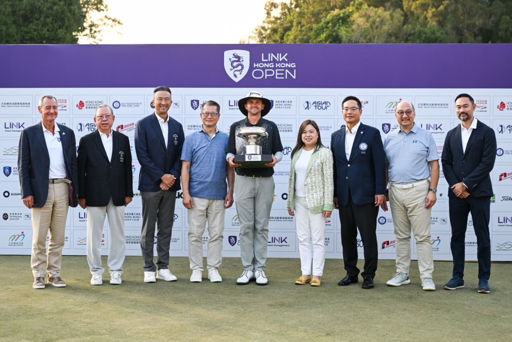 Guests with the tournament winner, John Carlin (center) at the presentation ceremony.