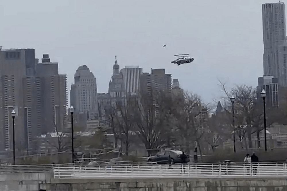 In this photo taken from video, a helicopter falls from the sky into the Hudson River , Thursday, April 10, 2025, in Jersey City, N.J. (Bruce Wall via AP)